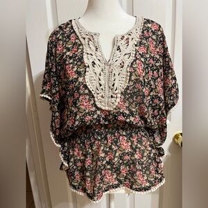 Black and pink floral blouse with white lace trim and pom pom detailing (E)
